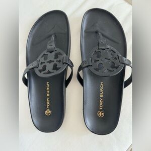 Tori Burch, “Miller Cloud” black sandal.